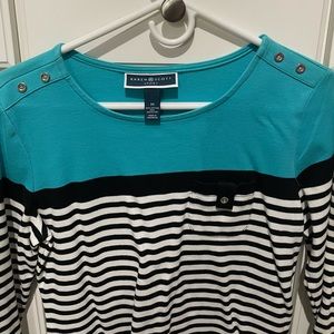 Women’s medium three-quarter length top. Pocket on front with button.